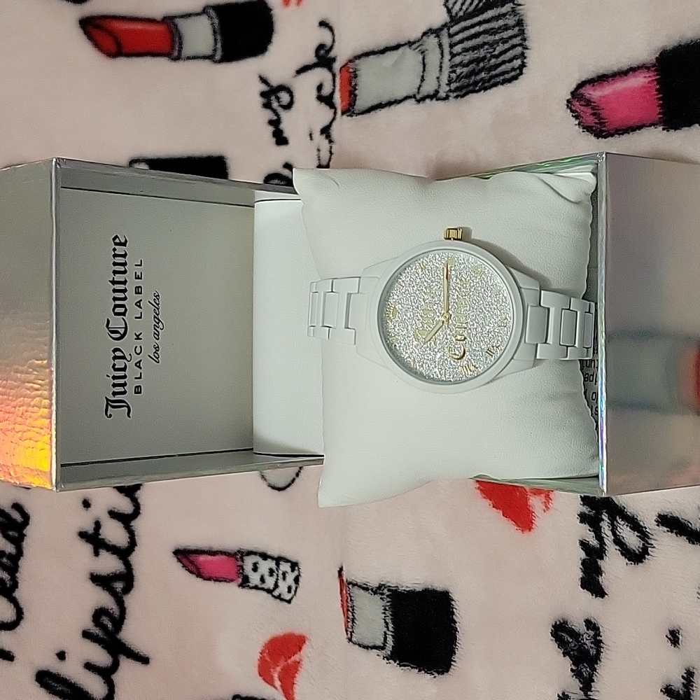White juicy couture watch with gold and silver glitter.